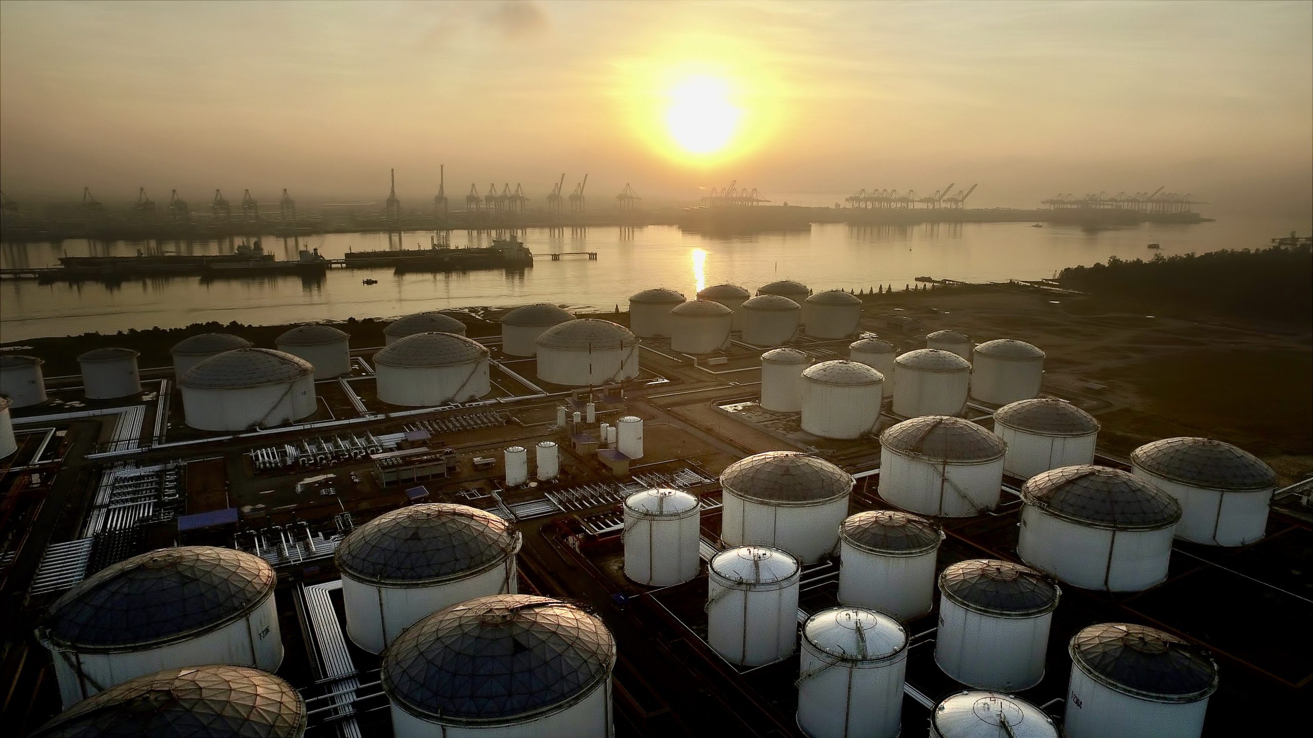 refinery and storage terminal at sunset