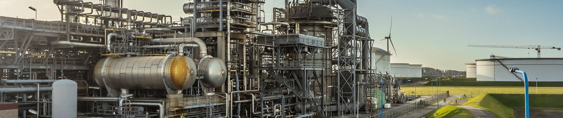 condensate facility and terminal with turbines and storage tanks in background