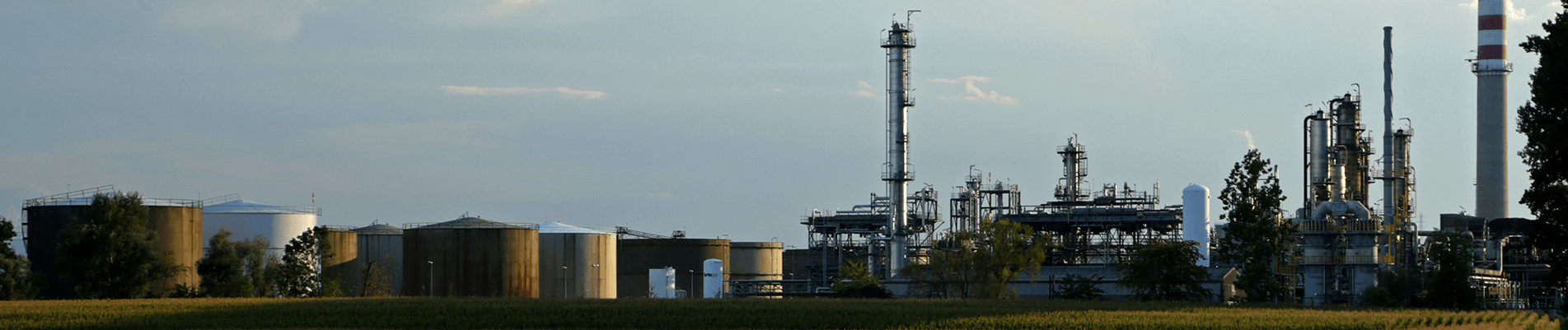 View of a refinery showing storage tanks and facility infrastructure