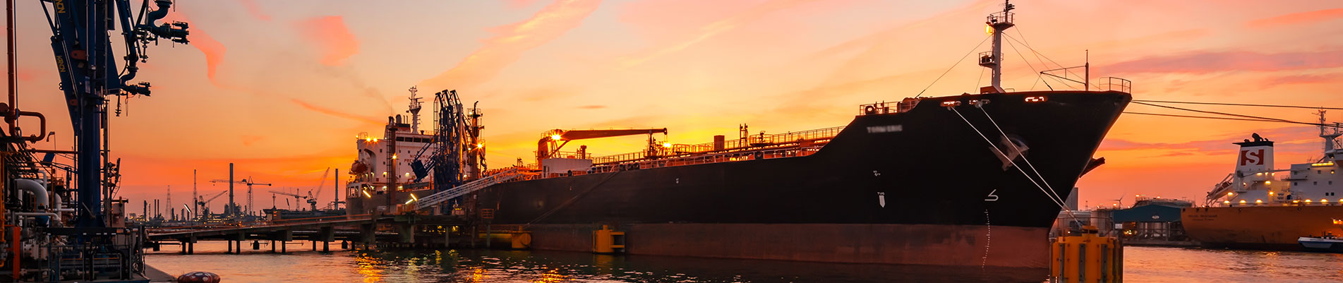 vessel at port at sunset