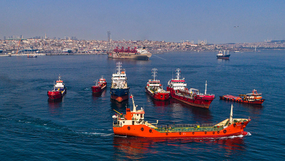 barges refueling ships in a harbour