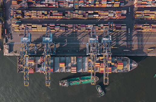 Bunkering barge loading marine fuels at cargo port